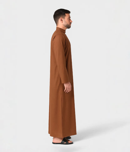 Arabic man in brown kandura for formal event